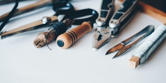 A variety of tools are laid out on a table.