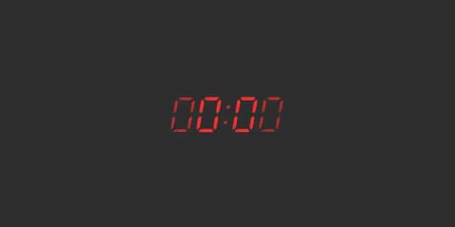 A red digital clock on a black background.