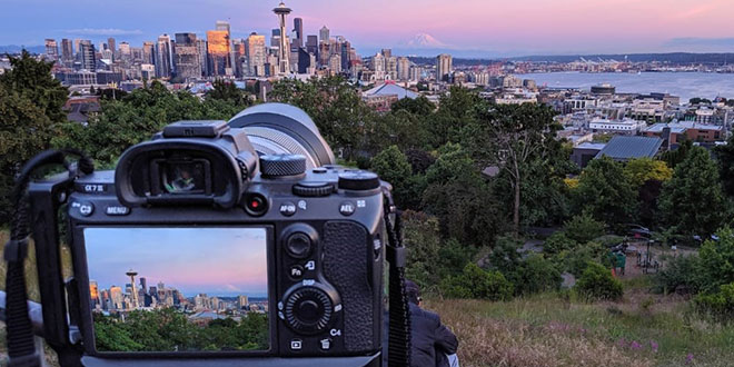 A camera with a view of the seattle skyline.