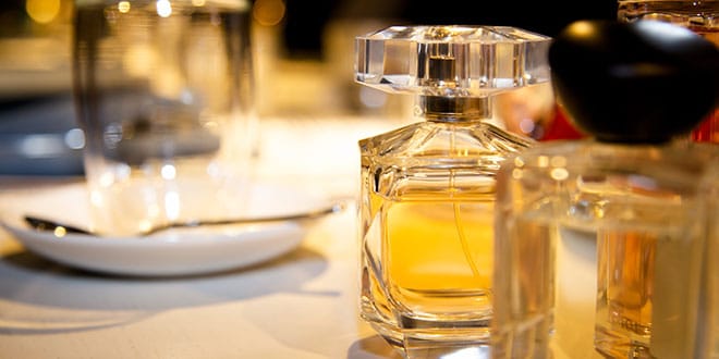 A table full of perfume bottles on a table.