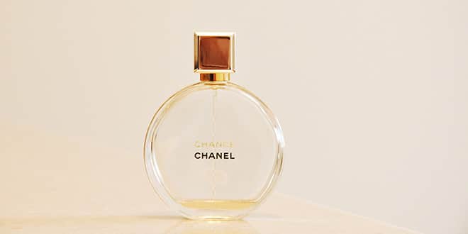 A bottle of chanel perfume on a table.