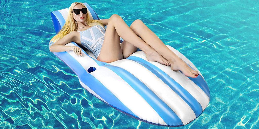 A woman is floating on an inflatable pool float.