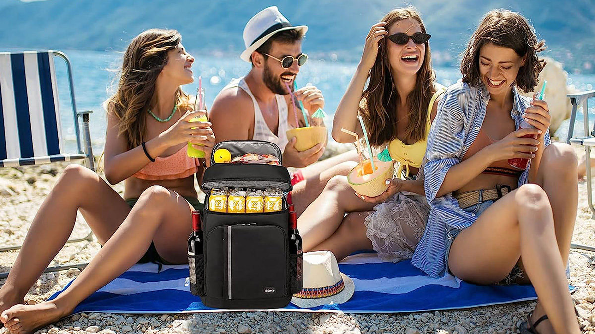 A group of people sitting on a beach with a LYPULY Cooler Backpack.