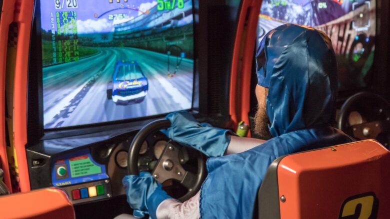 man in blue jacket driving car